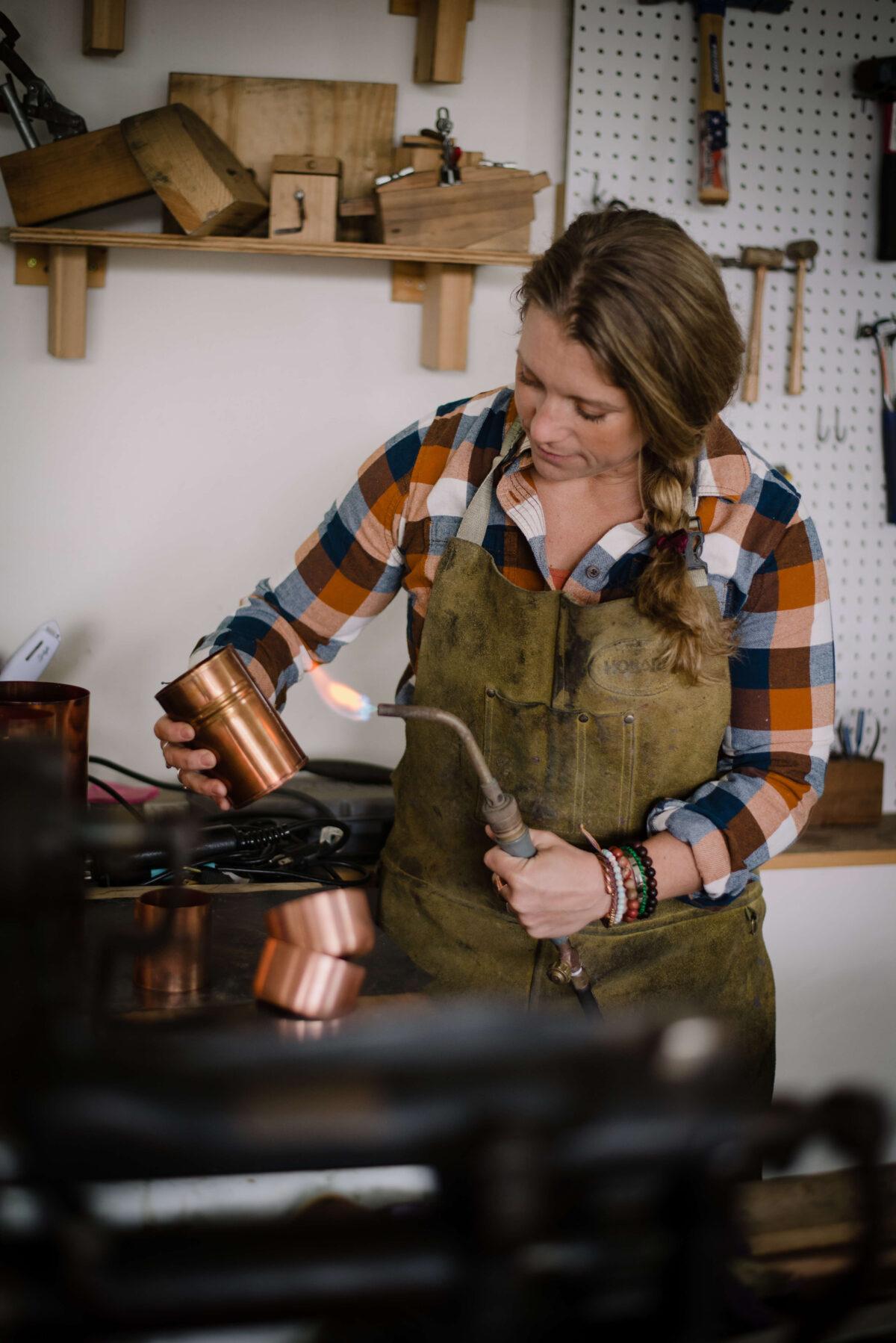 Dahmen sands, grinds, drills, rivets, hand-tins, buffs, and hand-polishes each piece at her home workshop in Wisconsin. (Courtesy of Sara Dahmen)