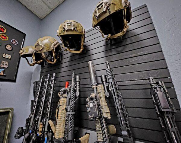 Mike Simpson said the weapons are real, but the ammunition is nonlethal, during classes on June 3, 2023. (Allan Stein/The Epoch Times)