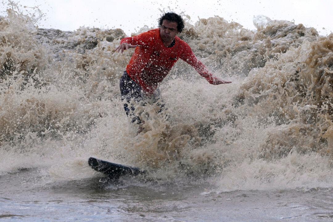Surfers at Amazon’s Mouth Ride Some of World’s Longest-Lasting Waves