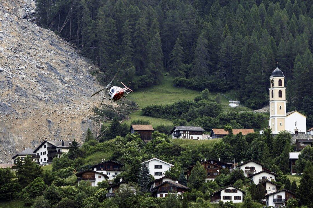 Mass of Rock Slides Down Swiss Mountainside Above Evacuated Village, Narrowly Missing Settlement