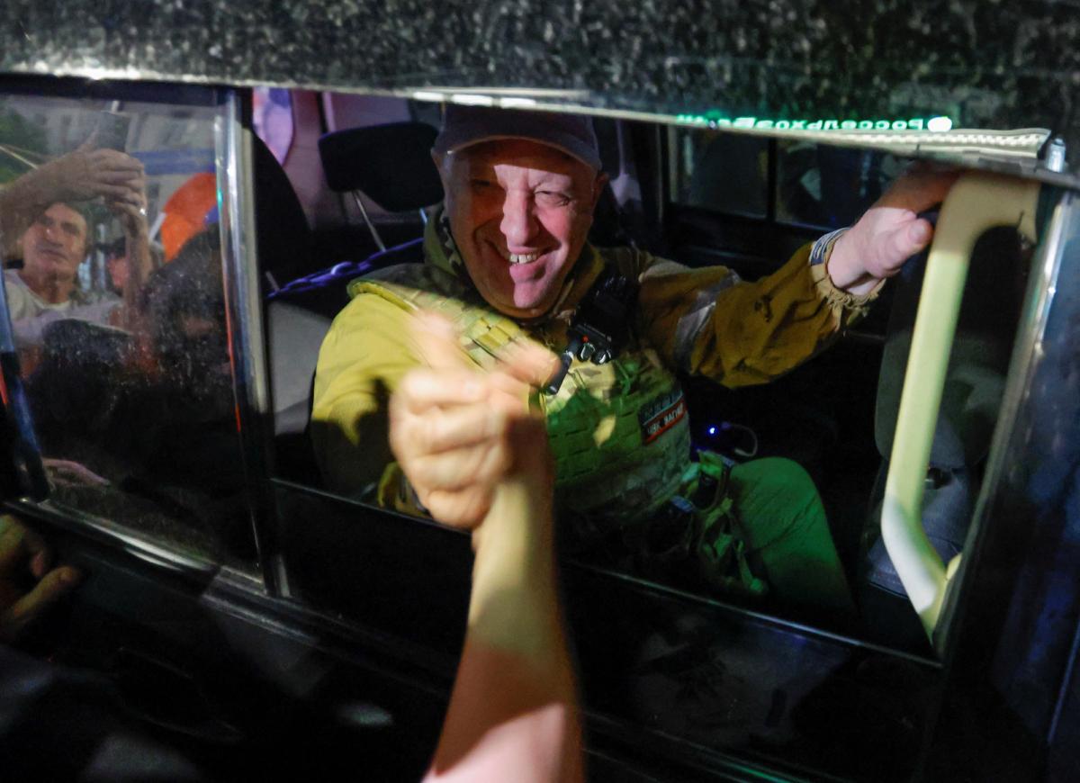 Yevgeny Prigozhin, owner of the Wagner Group military company, greets supporters as he prepares to leave Rostov-on-Don, Russia, on June 24, 2023. (Alexander Ermochenko/Reuters)