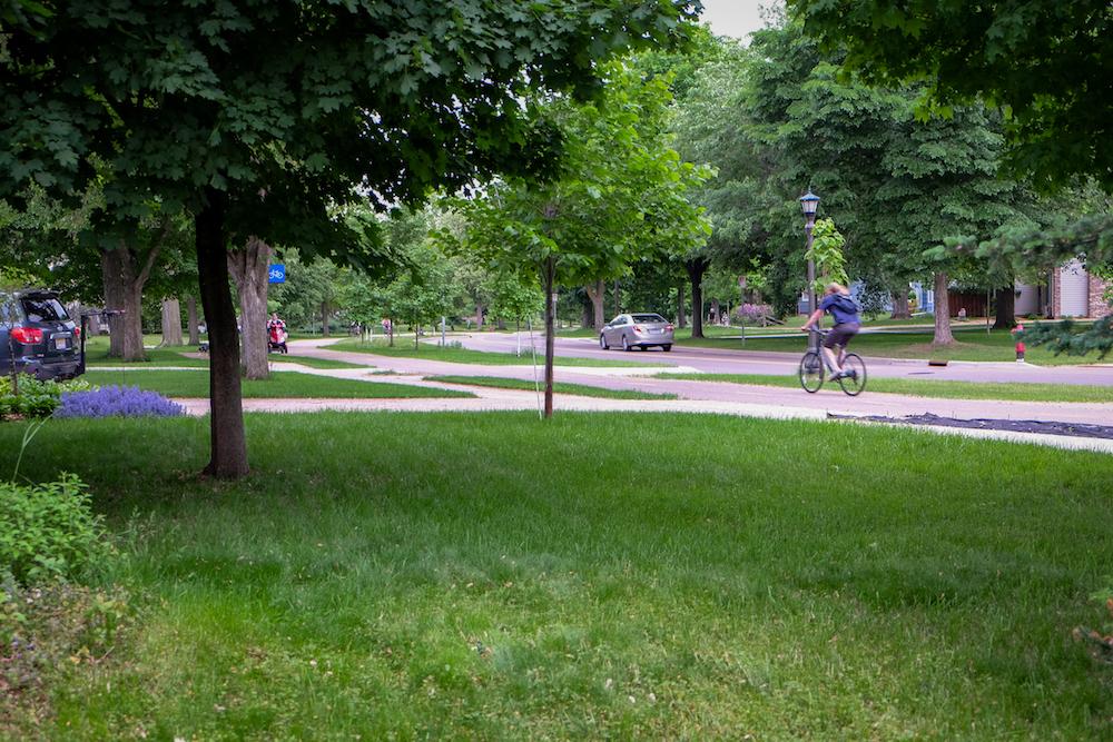 Passing by on the bike path and busy city street in front of Camacho's house, one would never know that an urban farm retreat sits only a few hundred feet away. (Annie Holmquist)