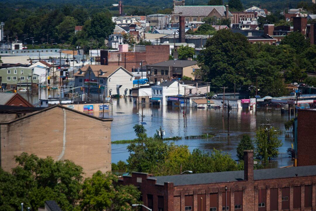Helicopter Crew Rescues Firefighters Stranded When Rescue Boat Goes Over Falls