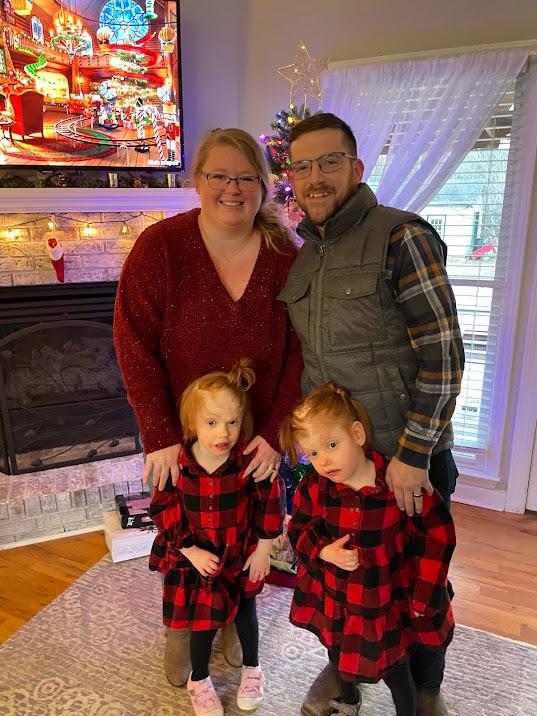Mr. and Ms. Delaney with their two daughters, Abby and Erin. (SWNS)