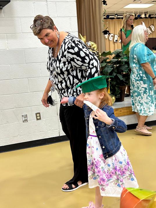 Erin graduates kindergarten. (SWNS)