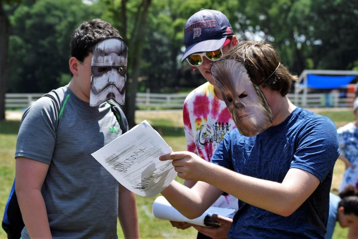 Children at Camp Liberty Lake in Bordentown, N.J., play while wearing Star Wars masks on June 27, 2018. (Courtesy of Andy Pritikin)