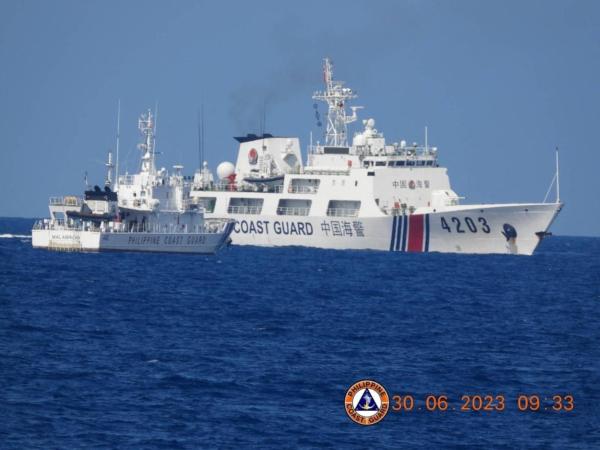 A Chinese Coast Guard ship obstructs the Philippine Coast Guard vessel Malabrigo as it provided support during a Philippine Navy operation near Second Thomas Shoal in the disputed South China Sea, June 30, 2023. (Philippine Coast Guard/Handout via Reuters)