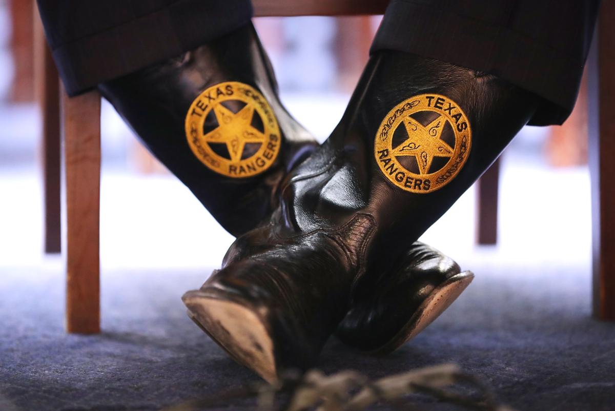 Texas Department of Public Safety Director Steven McCraw wears boots with the Texas Rangers seal as he testifies about a caravan of Central American migrants on Capitol Hill in Washington on April 12, 2018. (Chip Somodevilla/Getty Images)