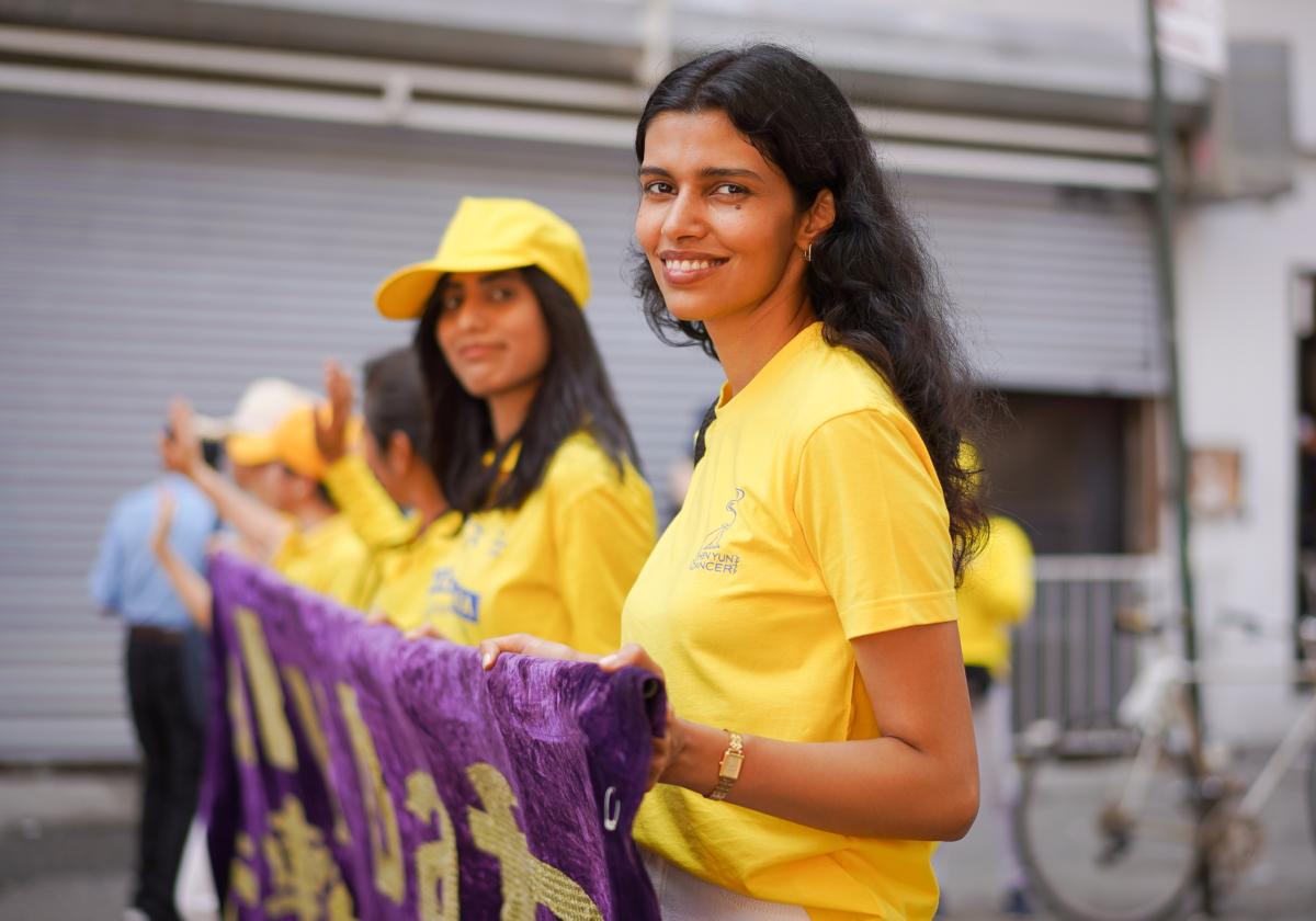 Falun Gong practitioners take part in a parade to commemorate the 24th anniversary of the persecution of the spiritual discipline in China, in New York's Chinatown on July 15, 2023. (Samira Bouaou/The Epoch Times)