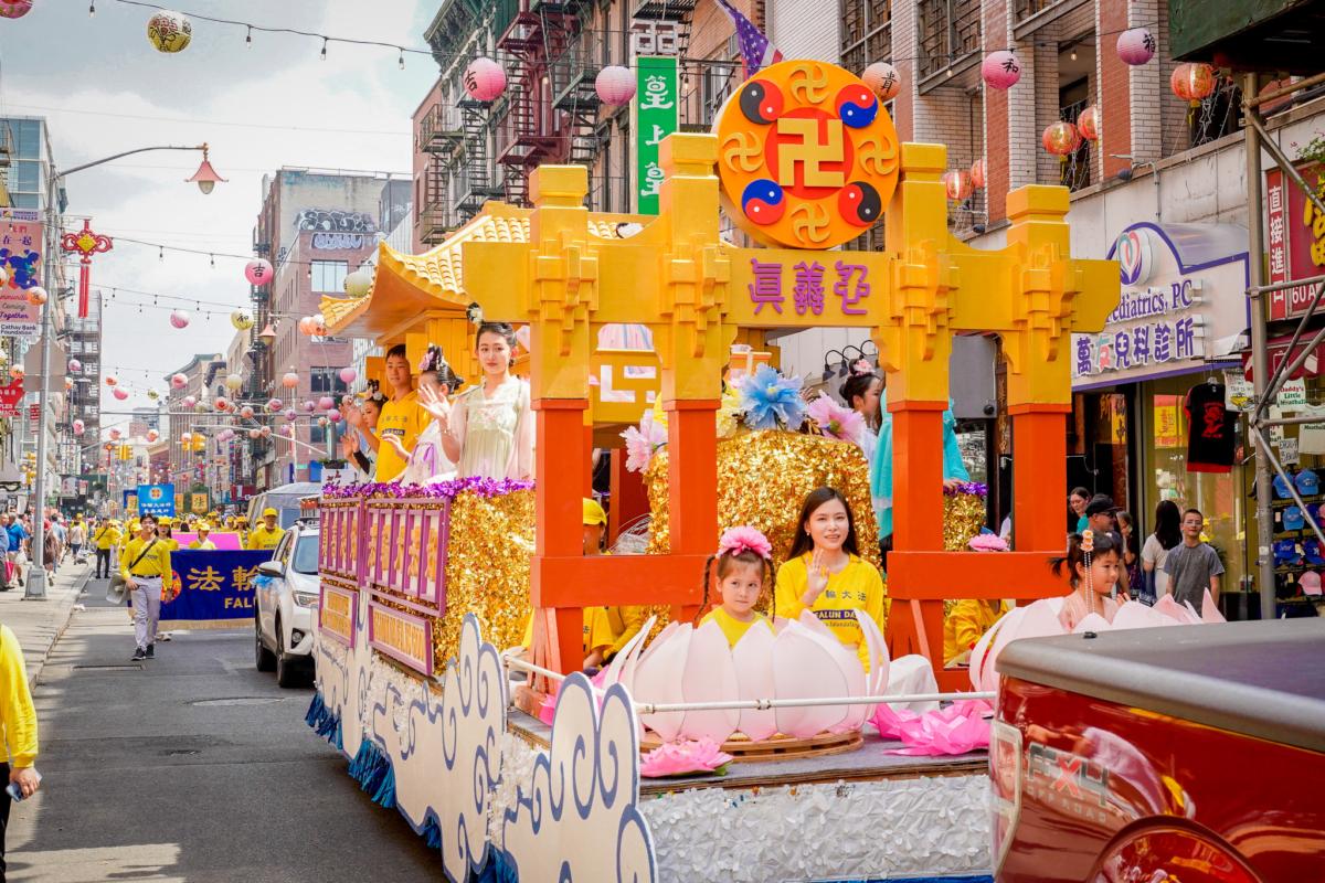 Falun Gong practitioners take part in a parade to commemorate the 24th anniversary of the persecution of the spiritual discipline in China, in New York's Chinatown on July 15, 2023. (Jingyi Zhang/The Epoch Times)