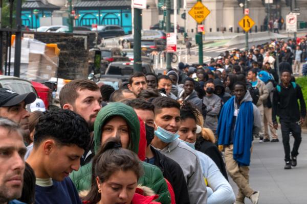 Hundreds of immigrants line up outside of the Jacob K. Javits Federal Building in New York City on June 6, 2023. New York City has provided sanctuary to over 46,000 illegal immigrants since 2013, when the city passed a law prohibiting city agencies from cooperating with federal immigration enforcement agencies unless there is a warrant for the person's arrest. (David Dee Delgado/Getty Images)