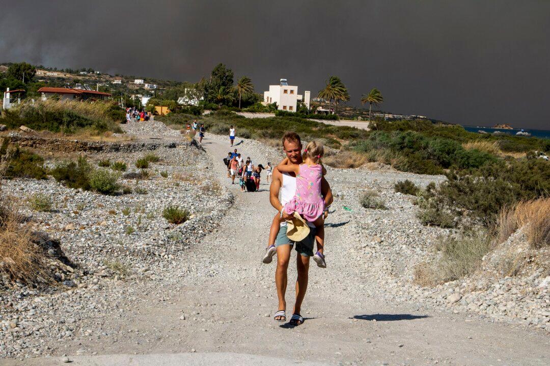 Tourists Flee Wildfires on Greek Island of Rhodes
