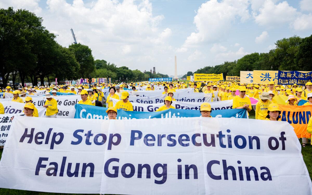 Falun Gong adherents take part in a rally to mark the 24th anniversary of the Chinese regime’s persecution of the spiritual discipline at the National Mall in Washington on July 20, 2023. (Samira Bouaou/The Epoch Times)