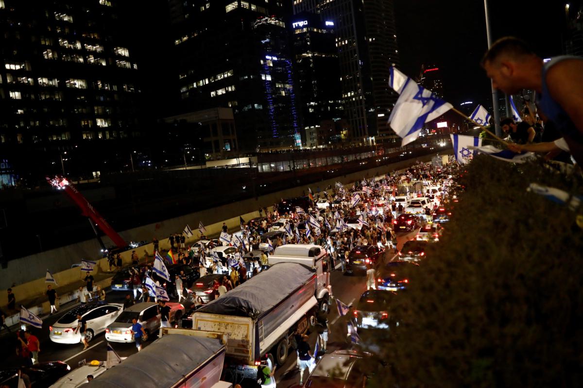 Protesters block part of Ayalon Highway during a demonstration following the parliament's vote on a contested bill that limits the Supreme Court's powers to void some government decisions, in Tel Aviv, Israel, on July 24, 2023. (Corinna Kern/Reuters)