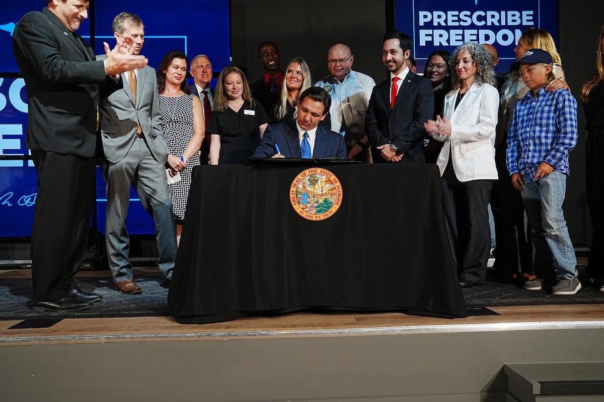 Florida Gov. Ron DeSantis signs a medical freedom bill in Florida on May 11, 2023. (Courtesy of the Florida Governor's Office)
