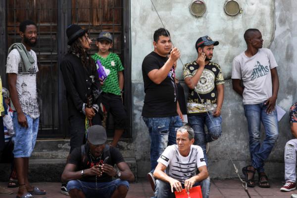 Migrants wait near a facility that processes asylum claims in Tapachula, Mexico, on June 24, 2019. (Charlotte Cuthbertson/The Epoch Times)