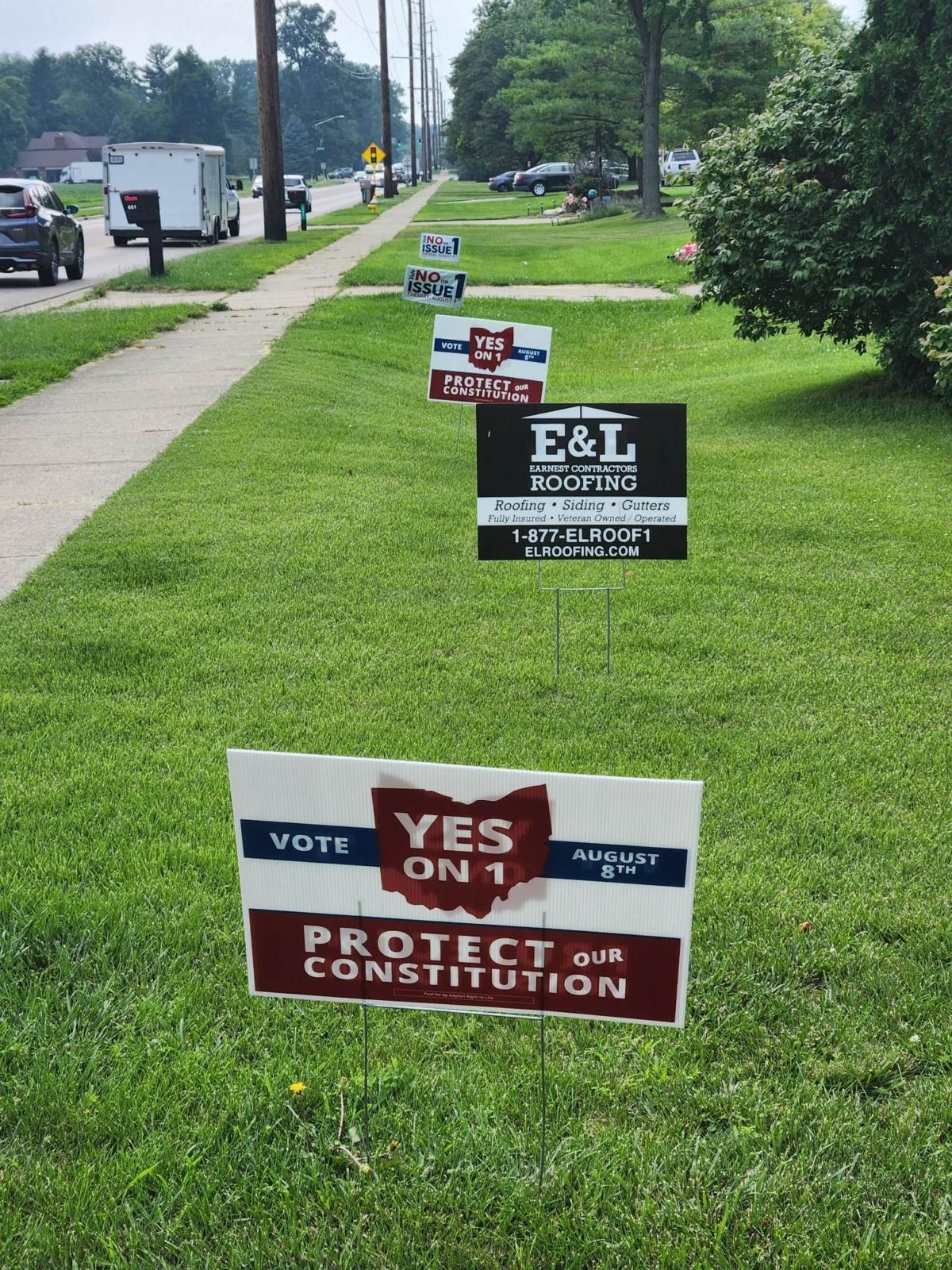 In neighborhoods across Ohio, yard signs reflect differing viewpoints on Issue 1. (Jeff Louderback/The Epoch Times)