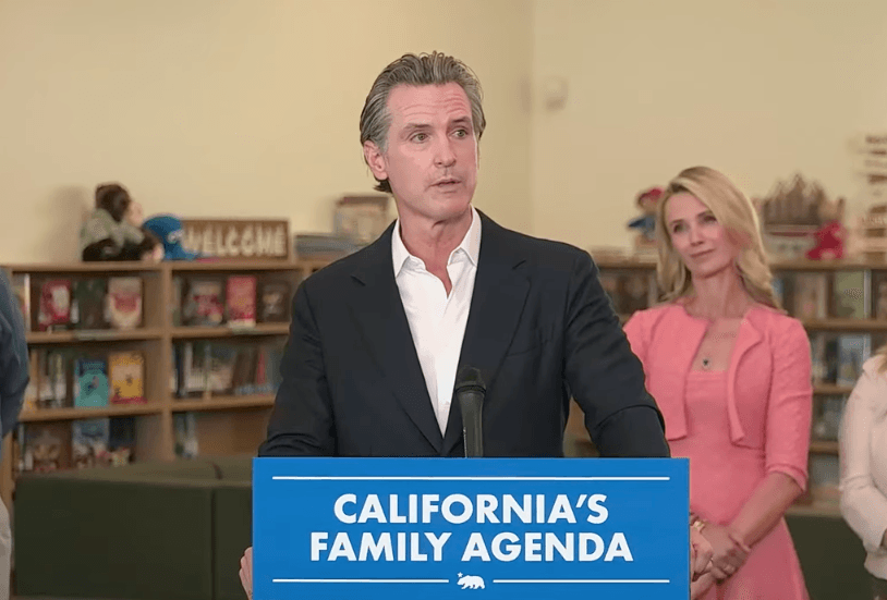 California Governor Gavin Newsom speaks as his wife Jennifer Siebel Newsom looks on at a press conference in Sacramento on Aug. 14, 2023. (California Governor Gavin Newsom/YouTube Screenshot via The Epoch Times)