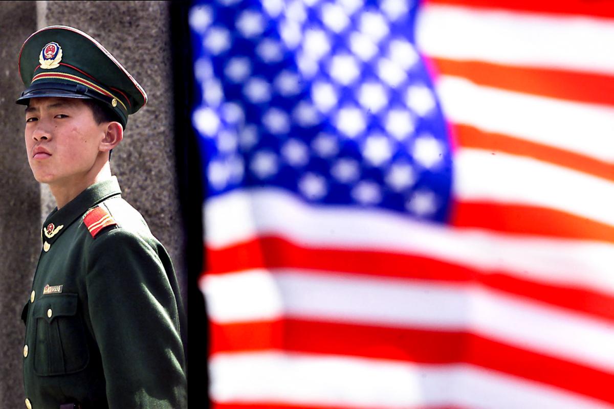 A Chinese military policeman stands guard in front of the U.S. embassy in Beijing on April 3, 2001. (Stephen Shaver/AFP via Getty Images)