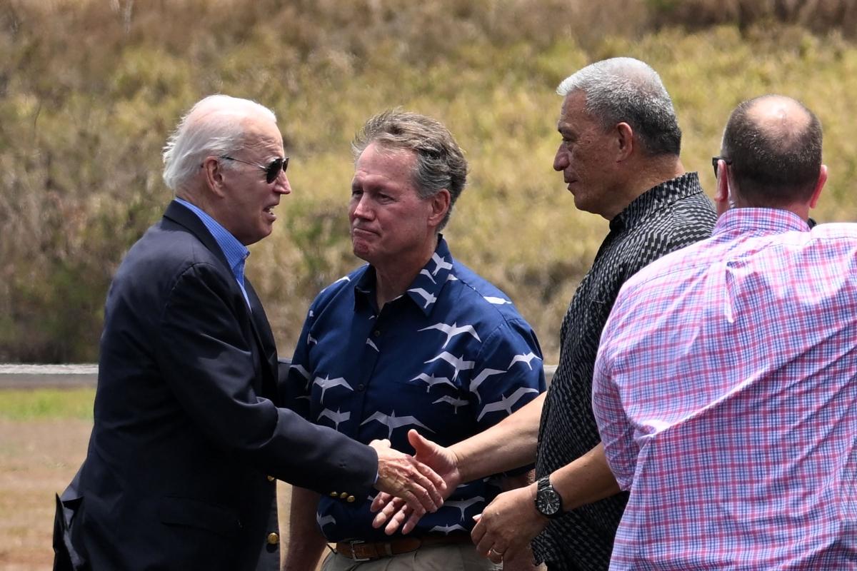 President Joe Biden greets Maui Mayor Richard Bissen (2nd R) and U.S. Representative Ed Case (HI-01) (C) at Kapalua Airport, Lahaina, Hawaii, on Aug. 21, 2023. (Mandel Ngan/AFP via Getty Images)