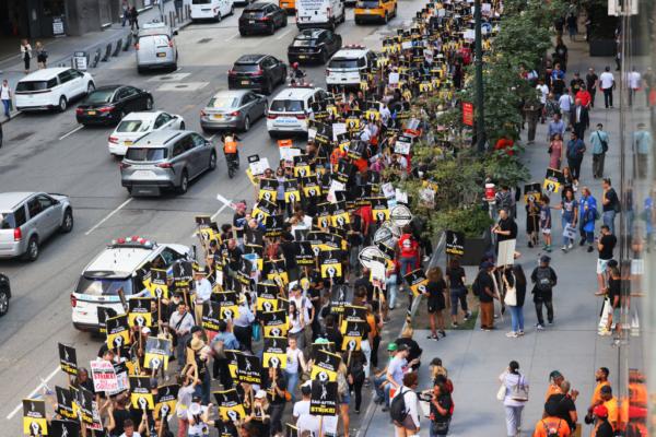 Members of SAG-AFTRA and Writers Guild of America East walk a picket line outside of the HBO/Amazon offices during the National Union Solidarity Day in New York City on Aug. 22, 2023. (Michael M. Santiago/Getty Images)