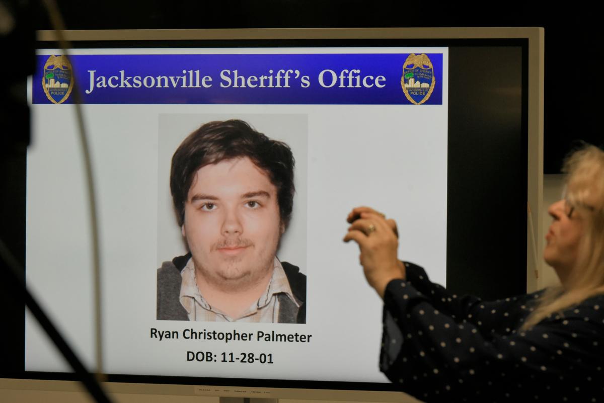 A photograph of shooter Ryan Christopher Palmeter is shown on a video monitor during Sheriff T.K. Waters’ press conference at the Jacksonville Sheriff’s Office headquarters building in Jacksonville, Fla., on Aug, 27, 20123. (Bob Self/The Florida Times-Union via AP)