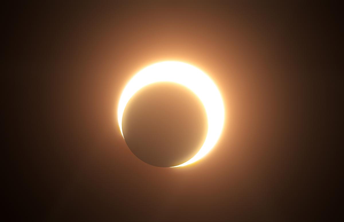 An illustration depicts an annular solar eclipse. (MOONCRUX/Shutterstock)