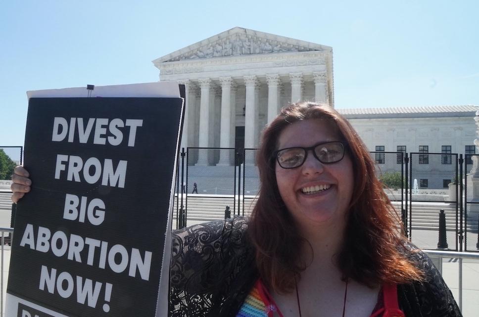 Left-wing pro-life protester Lauren Handy, the director of activism with Progressive Anti-Abortion Uprising, protests outside the U.S. Supreme Court on June 15, 2022.(Jackson Elliott/The Epoch Times)