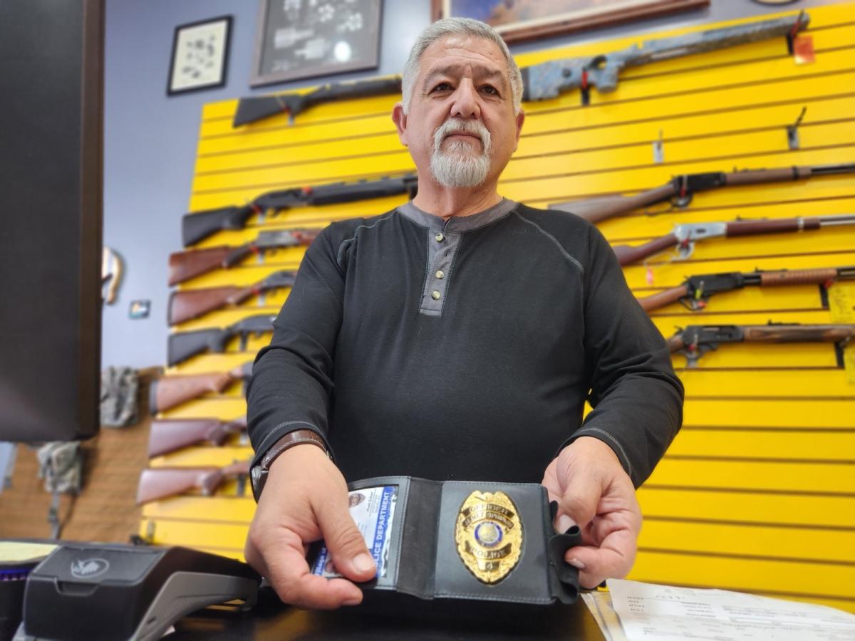 Arnold Gallegos, owner of ABQ Guns in Albuquerque, N.M., and a Jemez Springs Police Officer, is seen in his shop on Sept. 12, 2023. (Allan Stein/The Epoch Times)