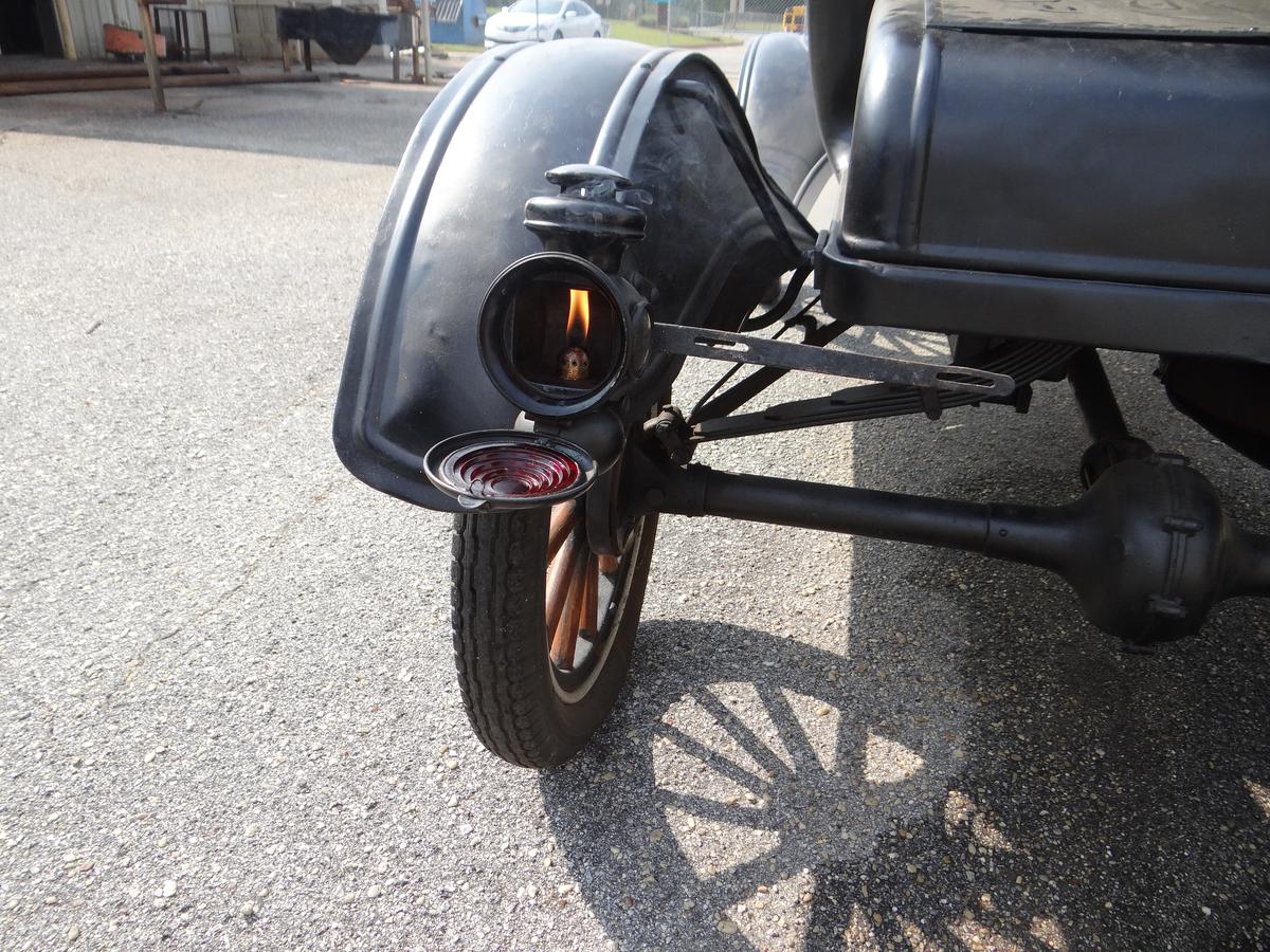 The glass-covered taillights are powered by actual kerosene lanterns that have to be lit. (Randy Tatano)
