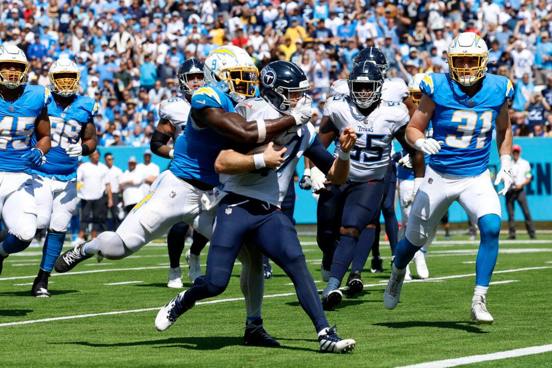 Ryan Tannehill Leads Titans Past Chargers in OT