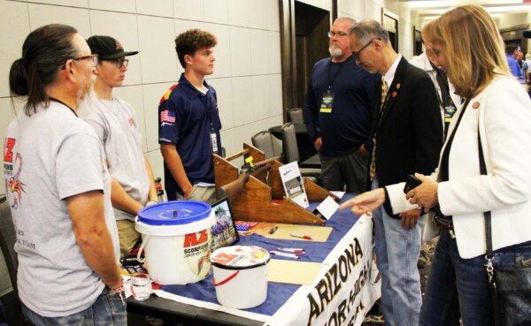 Members of the Arizona Junior High Power competition shooting team speak to attendees of the 38th Gun Rights Policy Conference in Phoenix on Sept. 23, 2023. (Michael Clements/The Epoch Times)