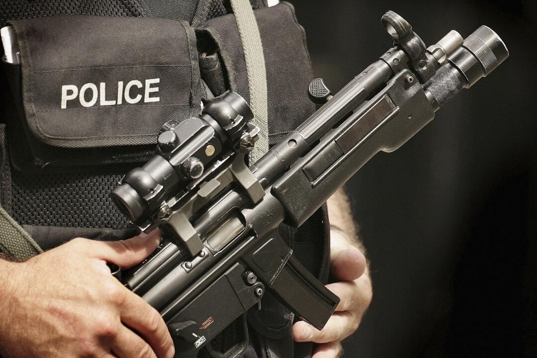 Home Secretary Orders Review as Armed Police Officers Return Guns