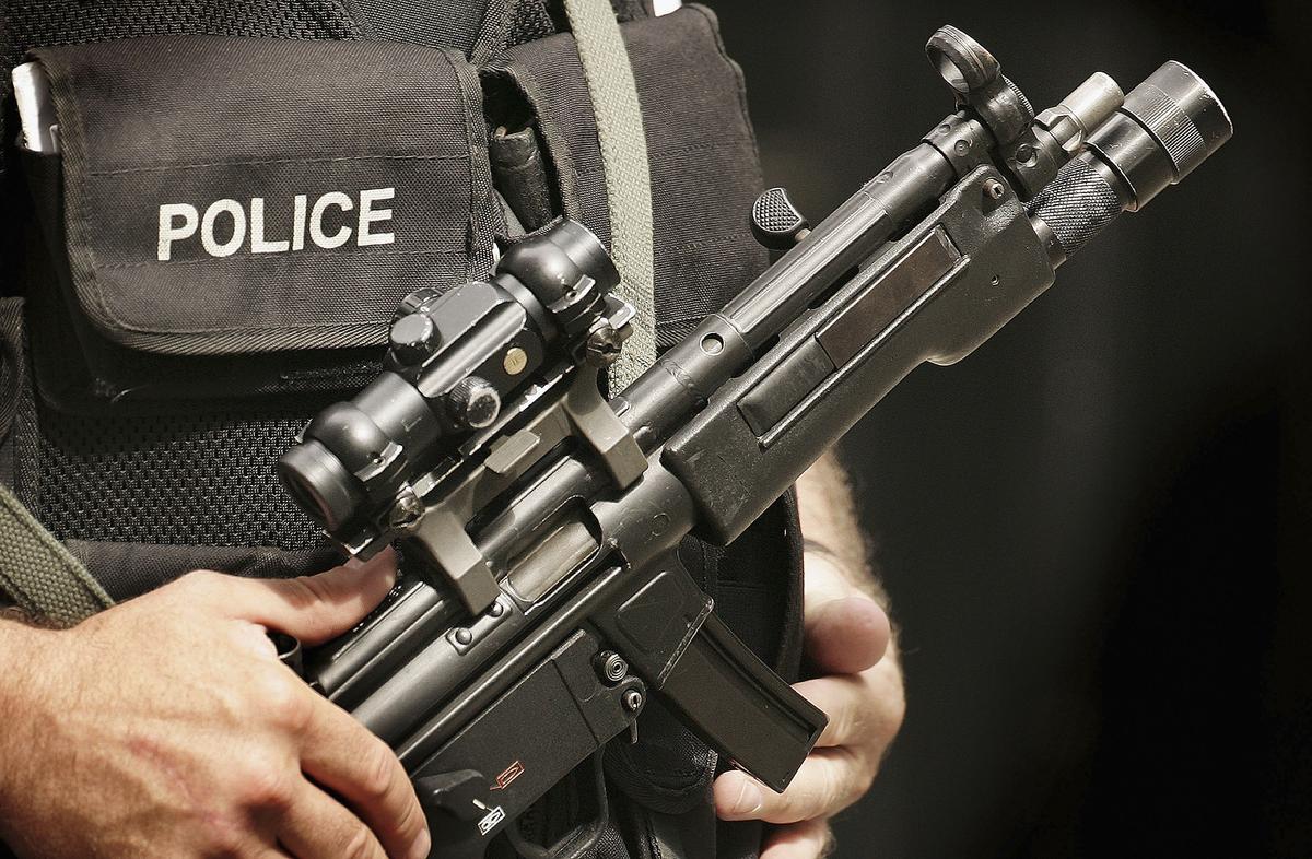 Home Secretary Orders Review as Armed Police Officers Return Guns