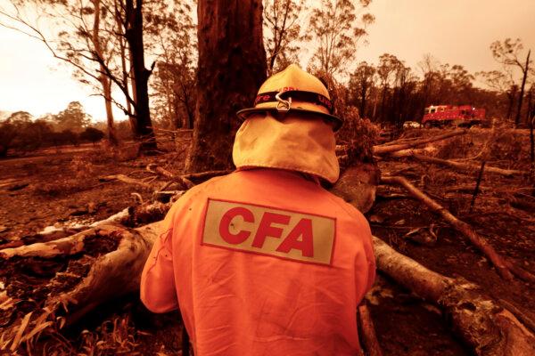Fire crews put out spot fires in Sarsfield, Australia, on Jan. 4, 2020. (Darrian Traynor/Getty Images)