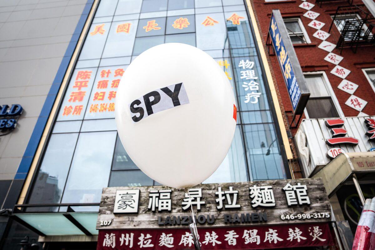 A balloon is held at a press conference and rally in front of the America ChangLe Association highlighting Beijing's transnational repression, in New York City on Feb. 25, 2023. A now-closed overseas Chinese police station was located inside the association's building. (Samira Bouaou/The Epoch Times)