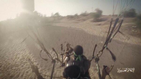 Fighters from the Hamas terrorist group use paragliders to train for landing in Israel in video footage released on Oct. 9, 2023. (Reuters/Screenshot via NTD)
