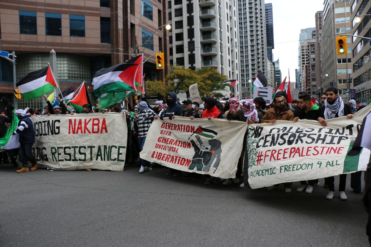 Pro-Palestine Protesters Crowd Into the Streets in Toronto, Blocking Traffic