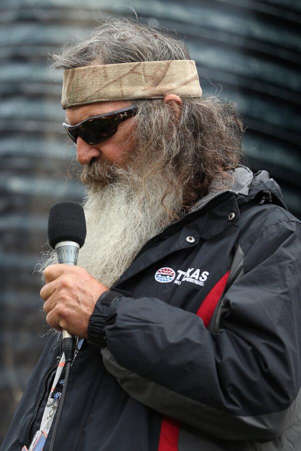 "Duck Dynasty" star Phil Robertson gives the invocation prior to the NASCAR Sprint Cup Series Duck Commander 500 at Texas Motor Speedway in Fort Worth, Texas, on April 9, 2016. (Chris Graythen/Getty Images)