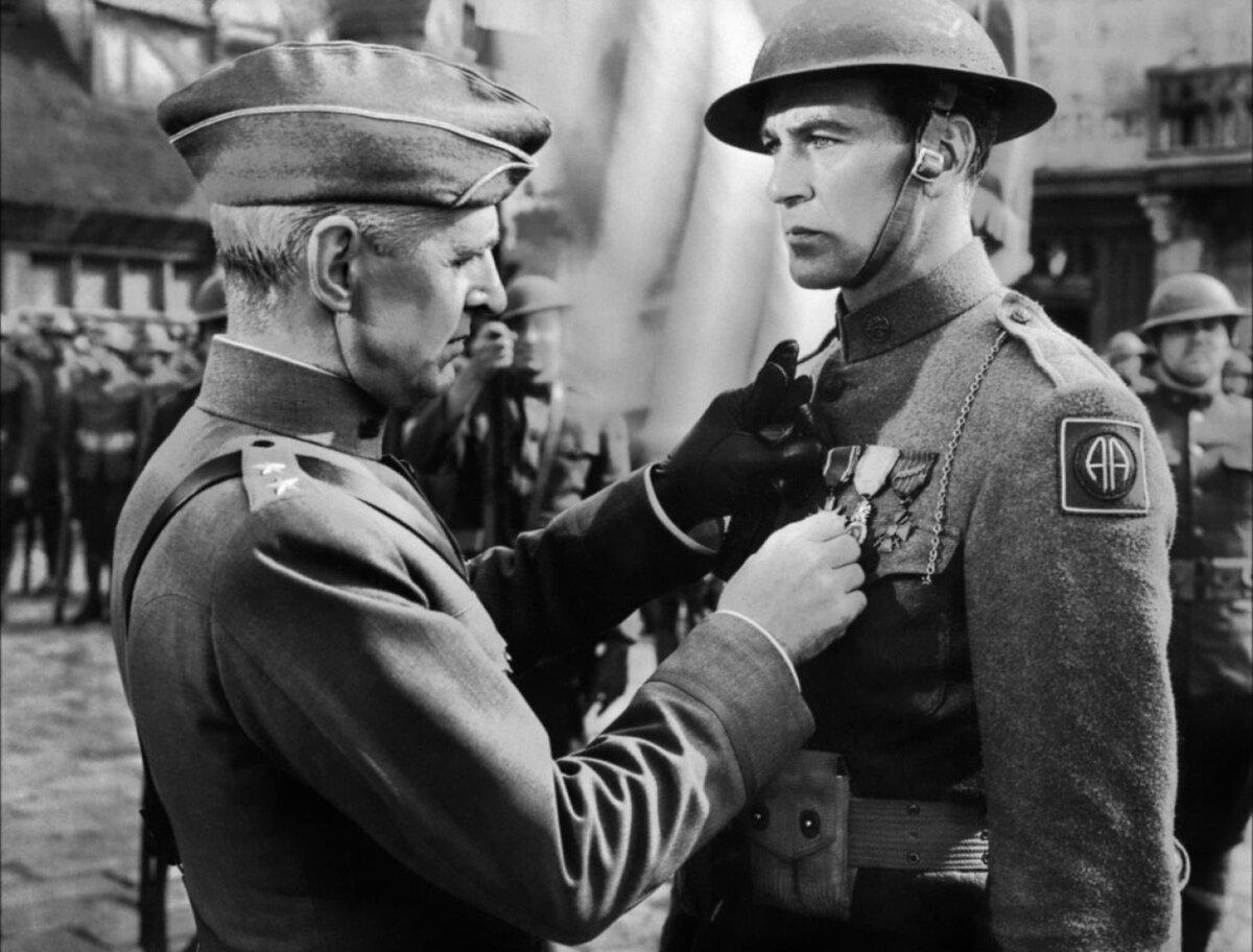 A publicity still for the 1941 film "Sergeant York," starring (L-R) Russell Hicks and Gary Cooper. (MovieStillsDB)
