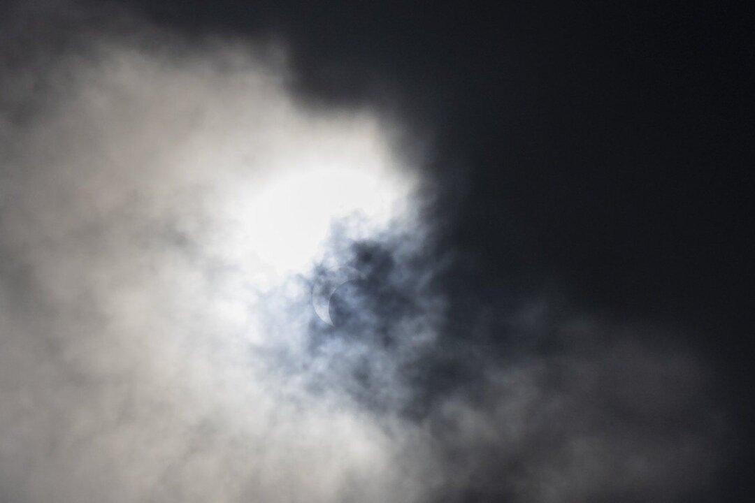 Cloud Breaks Bring Cheers From Partial Solar Eclipse Watchers at BC Observatory