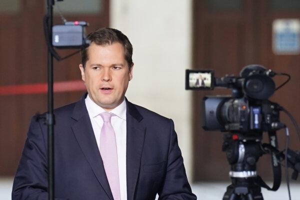 Immigration minister Robert Jenrick prepares to speak to the media outside BBC Broadcasting House in London on Oct. 22, 2023. (Stefan Rousseau/PA)
