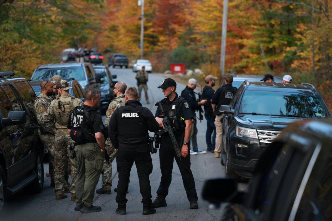 Police Surround Home in Search for Suspect in Fatal Shooting of 18 in Maine