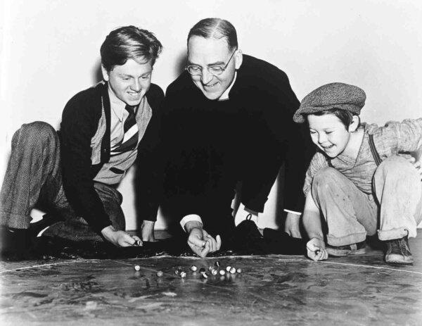 Behind the scenes of “Boys Town” (L–R) Mickey Rooney, Edward J. Flanagan, and Bobs Watson. (MovieStillsDB)