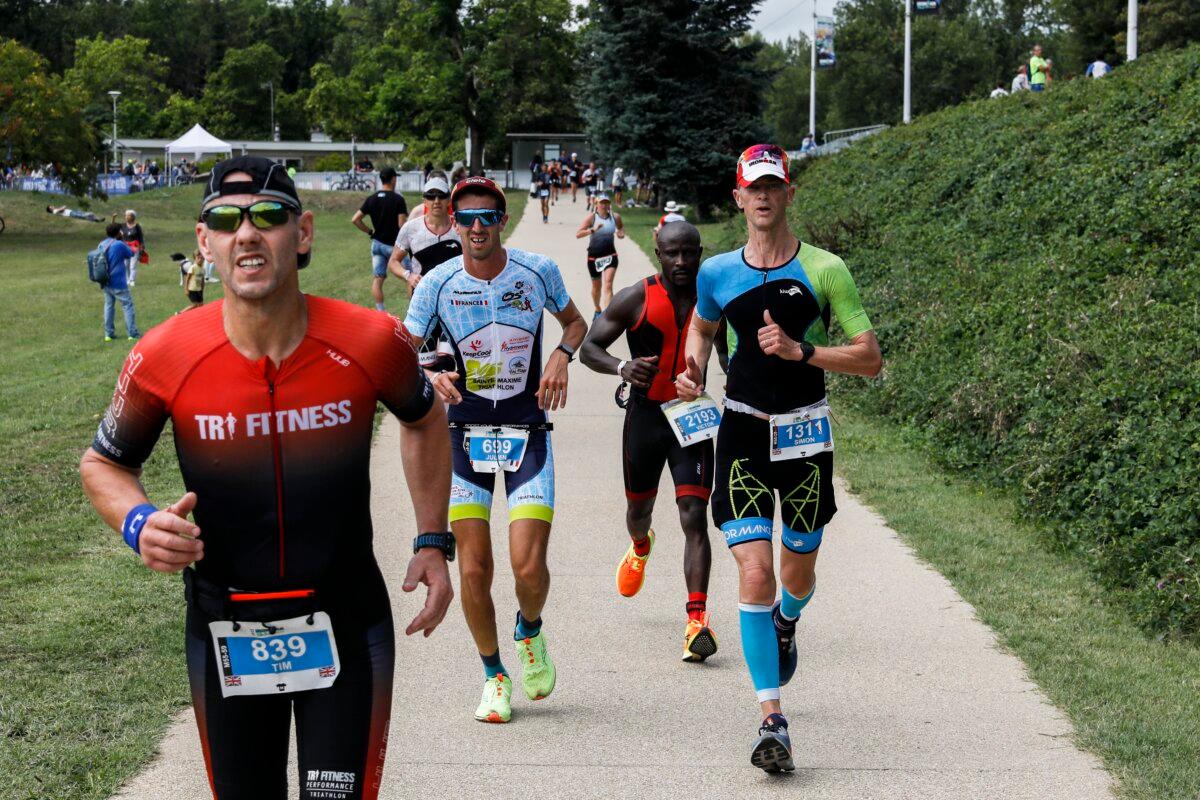 Athletes compete during the run leg of IRONMAN 70.3 Vichy on August 20, 2022 in Vichy, France. (Blazquez Dominguez/Getty Images for IRONMAN)