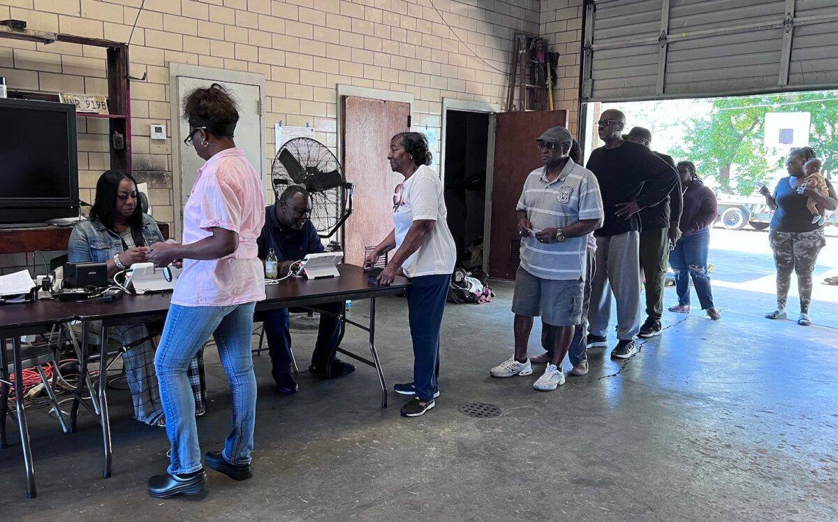 Voters queue at Fire Station No. 20 in Jackson, Miss., on Nov. 7, 2023. (Lawrence Wilson/The Epoch Times)