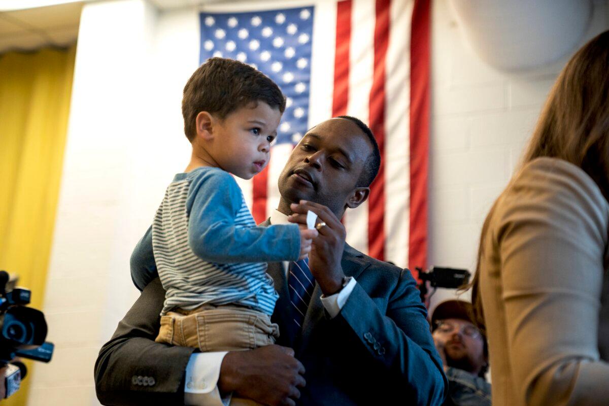 Republican's Candidate for Governor, Attorney General Daniel Cameron holds his son after casting his ballot in Louisville, Ky., on Nov. 7, 2023. (Michael Swensen/Getty Images)