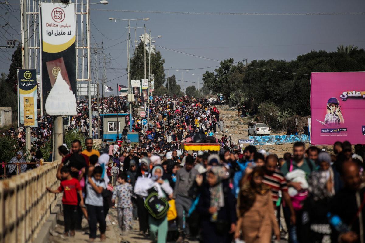 Palestinian citizens displaced from Gaza City to the southern Gaza Strip on Salah al-Din Street in the Al-Mughraqa area in Gaza, on Nov. 10, 2023. (Ahmad Hasaballah/Getty Images)