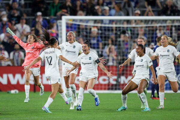 Ali Krieger (11) of NJ/NY Gotham FC reacts with teammates, including Midge Purce (Front Right) after defeating OL Reign during the 2023 NWSL Championship game in San Diego on Nov. 11, 2023. (Meg Oliphant/Getty Images)