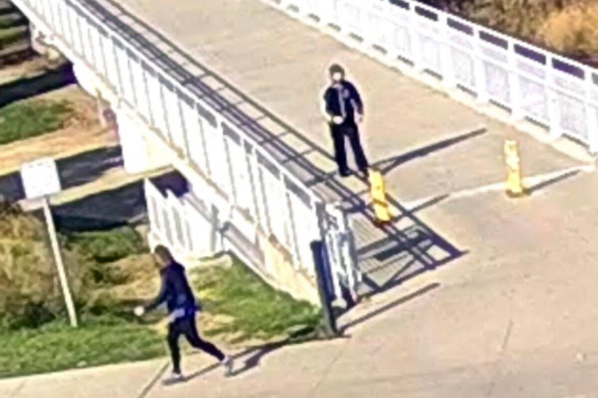 Former senator Martha McSally (L) of Arizona looks back at a man while jogging at Tom Hanafan River’s Edge Park in Council Bluffs, Iowa, on Nov. 8, 2023. (Council Bluffs Police Department via AP)